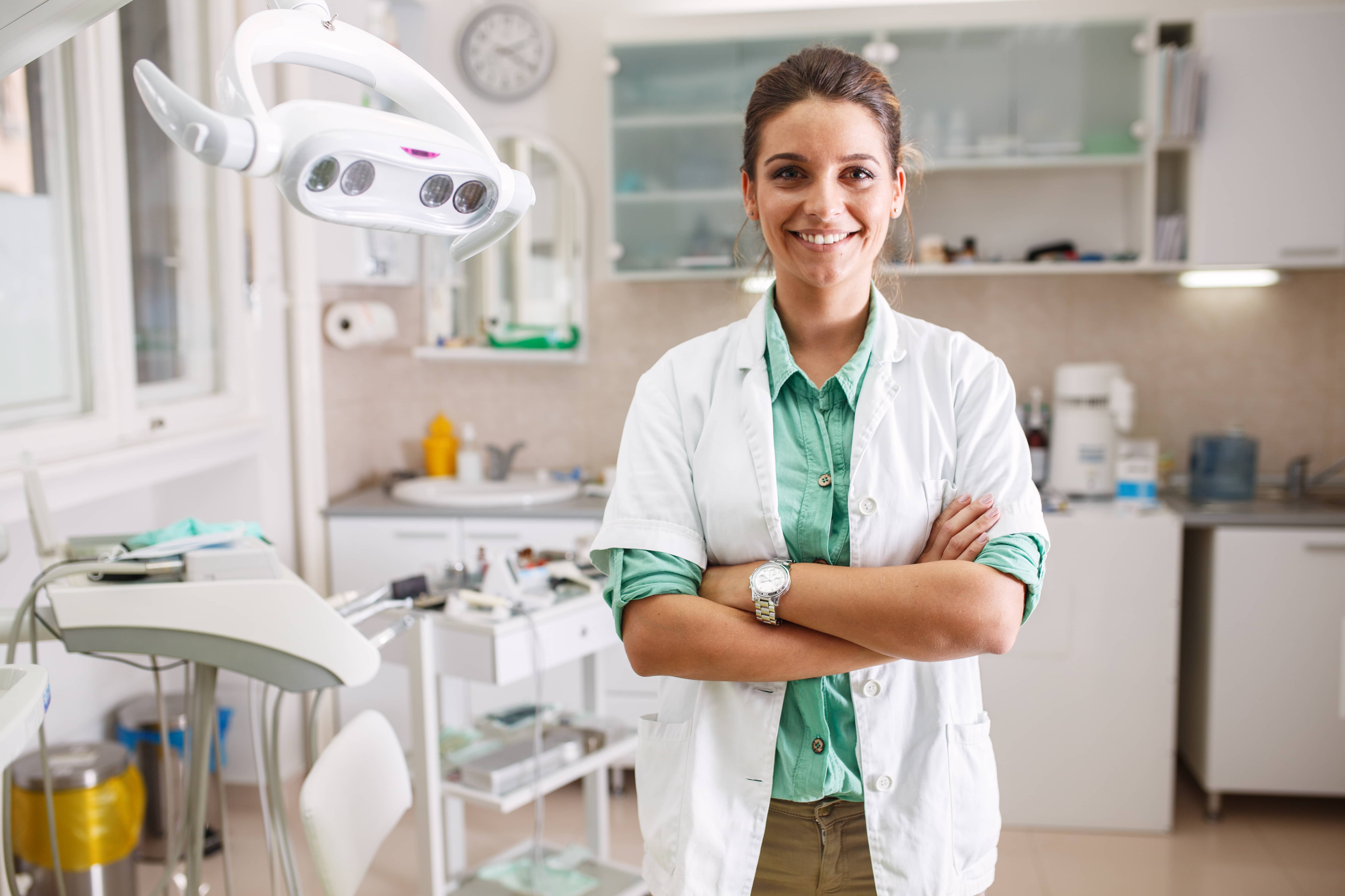 Dentist folding her arms